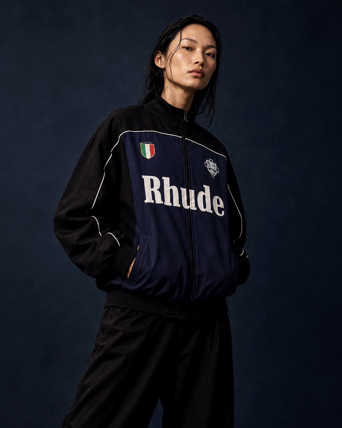 Navy track jacket in an alternate editorial view