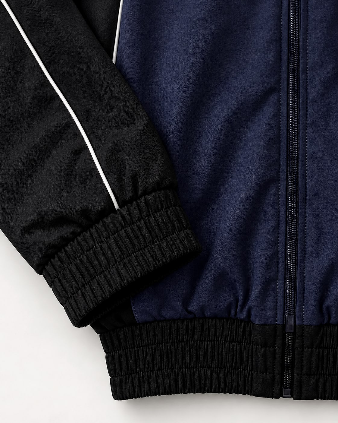 Close-up of the track jacket cuff, hem and zip